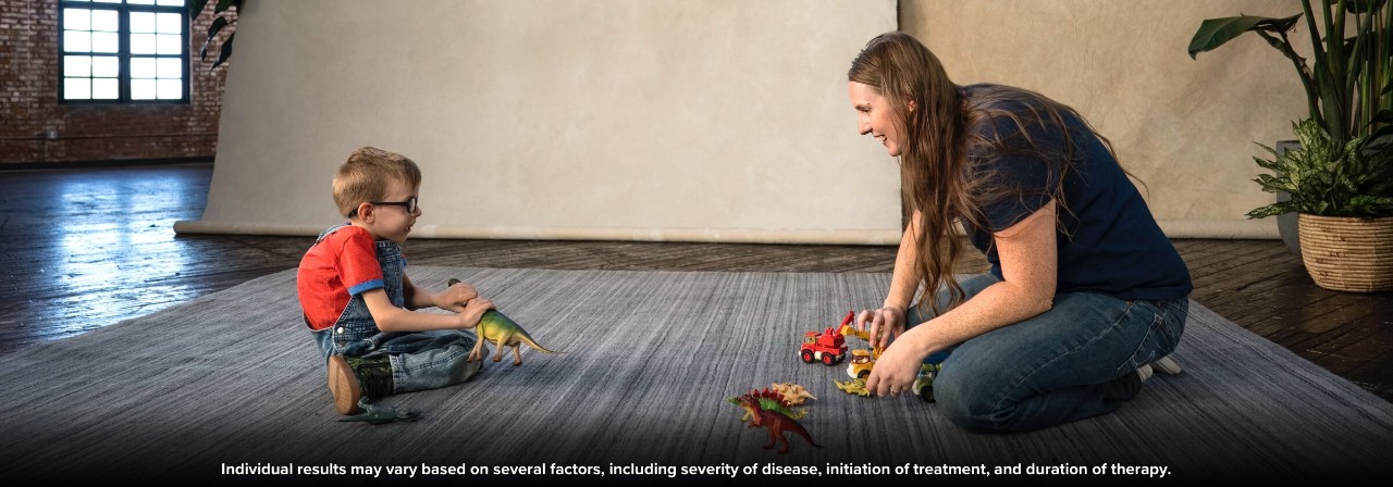 A child with SMA who is treated with SPINRAZA and a caregiver